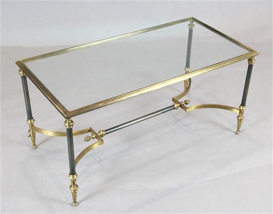 Attributed to Maison Jansen. A gilt and ebonised bronze coffee table, W.2ft 11.5in. D.1ft 5.5in. H.1ft 5.5in.